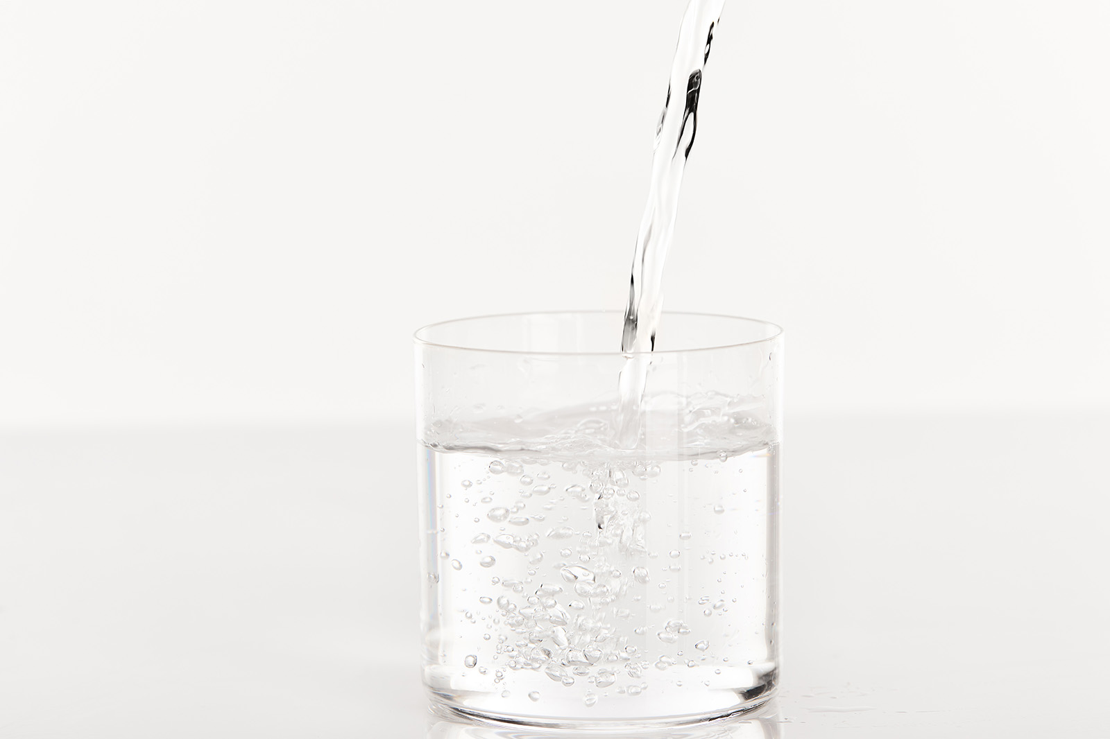 clear-fresh-water-pouring-into-glass